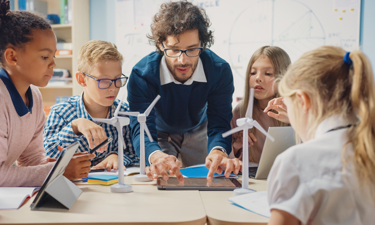 a man teaching a group of children